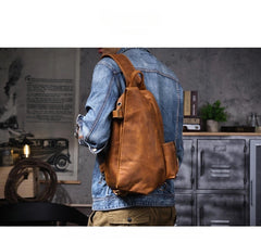 Large leather sling bag - built-in headphone cable grommet detail