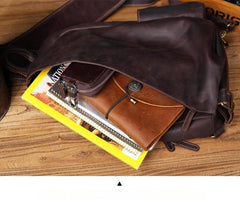 Large leather sling backpack - front view showing pocket layout
