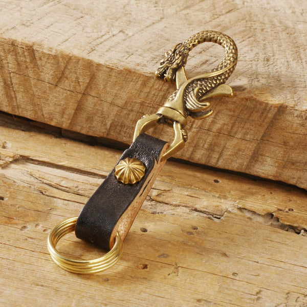 Creative Co-op Brass Key Chain with Saying and Leather Tassel